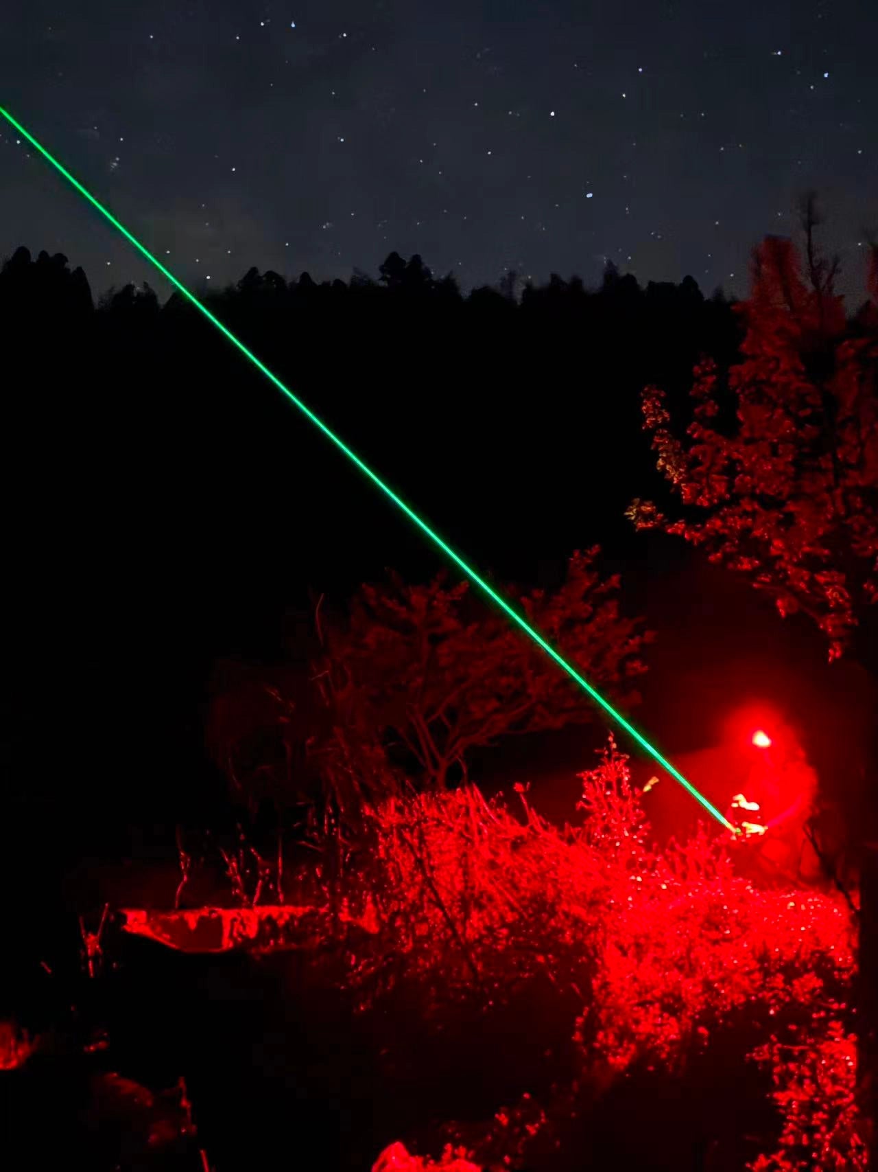 Laser pointing to the night sky
